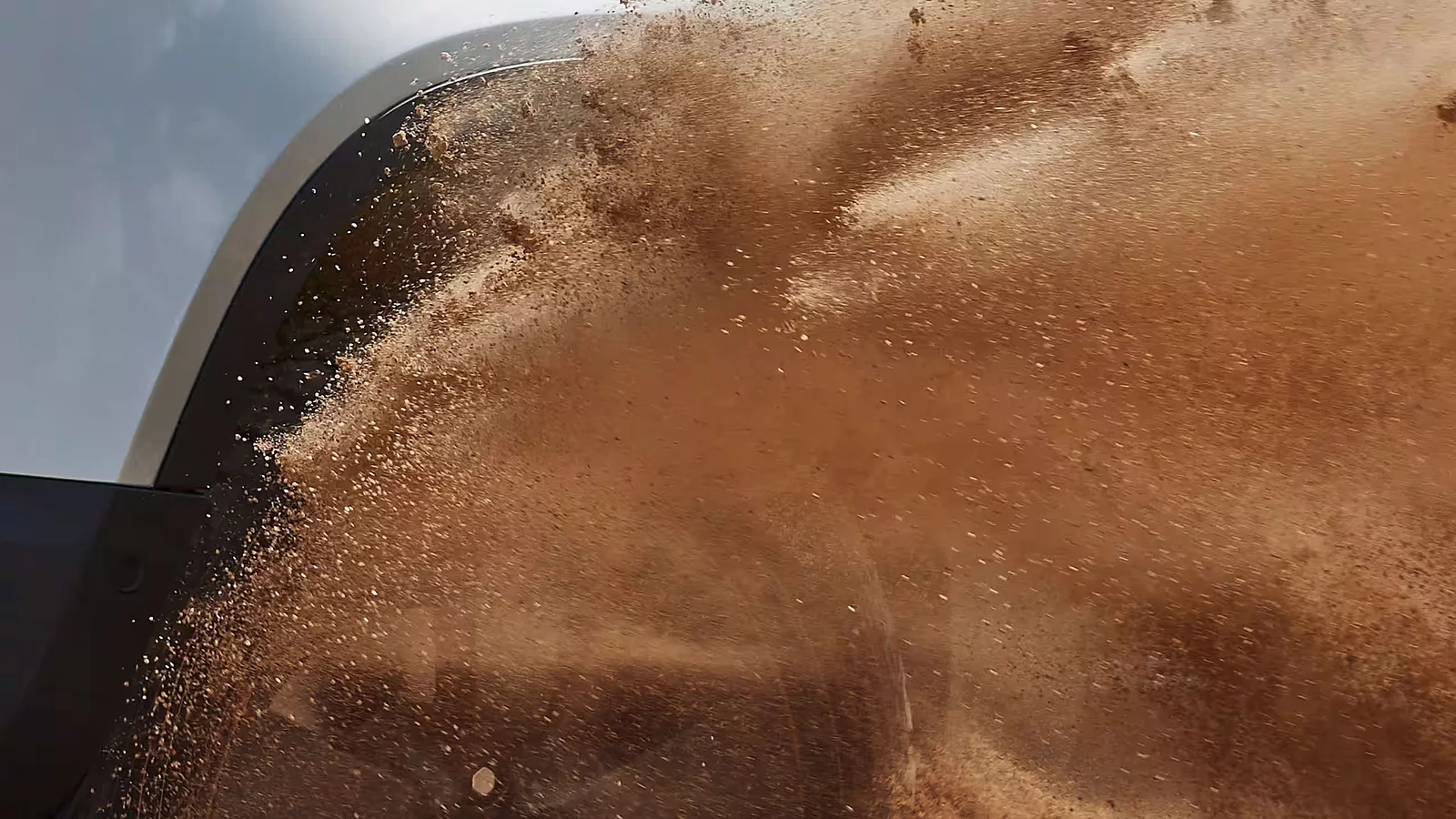 Close up of car drifting in sand