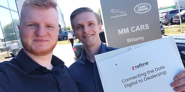 in front of car showroom jaguar land rover