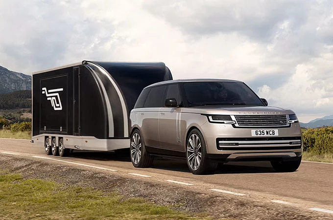 New Range Rover driving on mountain runway road