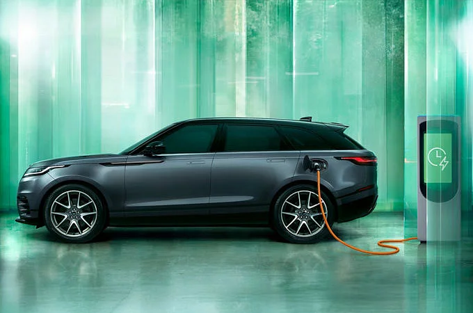 Parked Range Rover velar charging at the phev station point