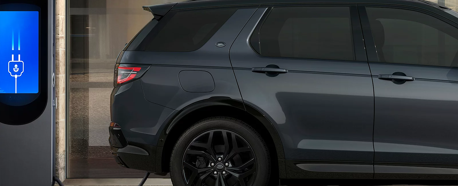 Discovery sport standing at charging Phev point