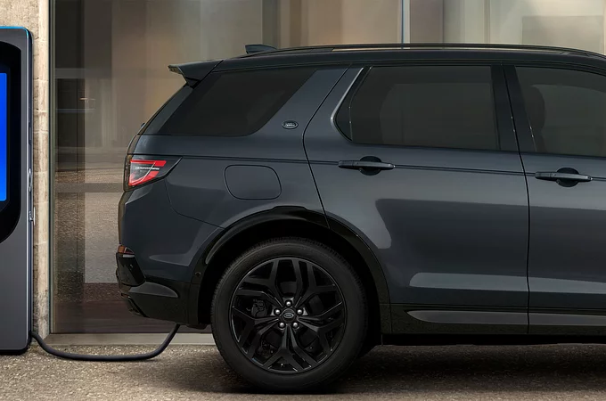 Discovery sport standing at charging Phev point