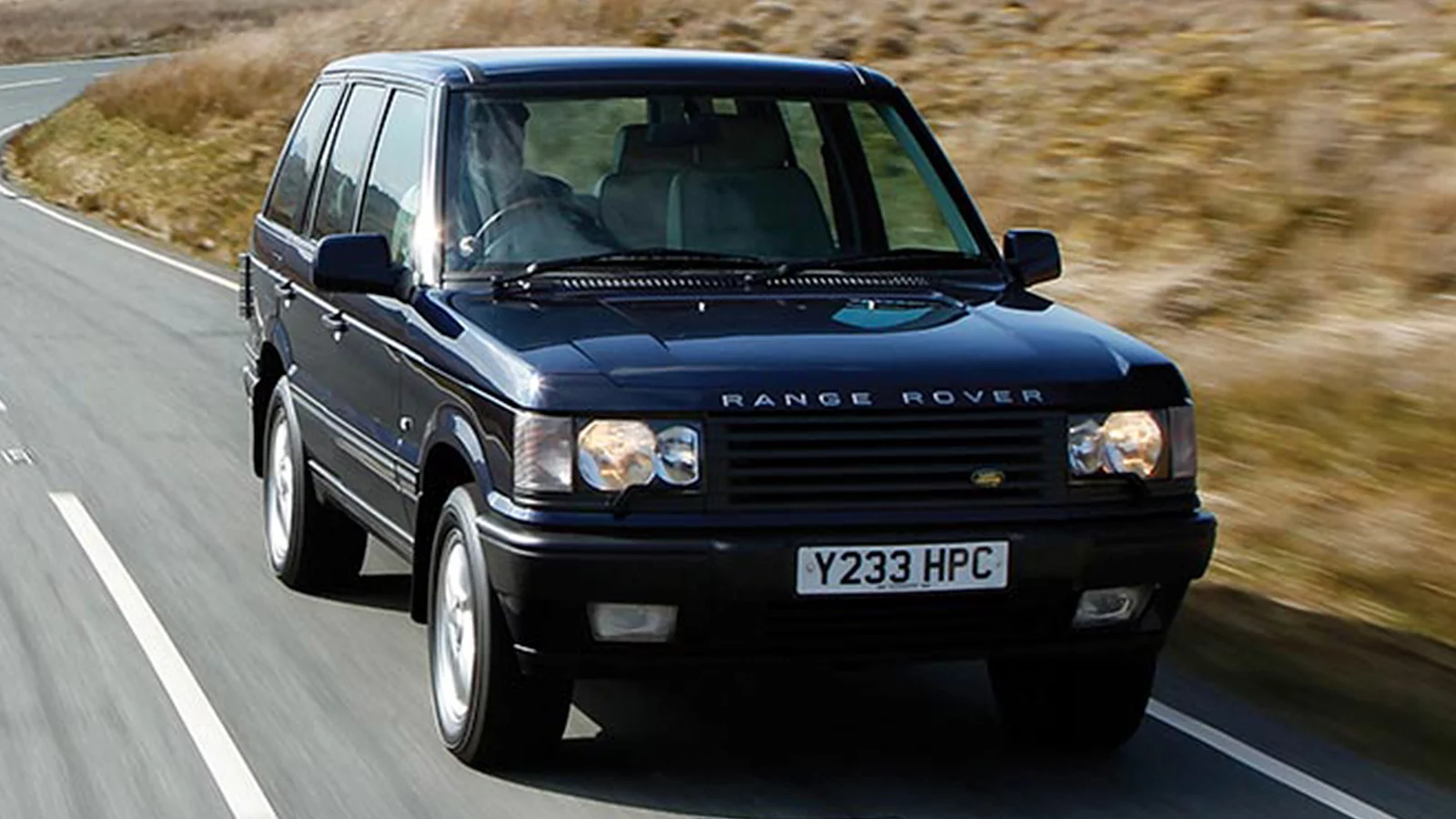 Range Rover Classic driving on road