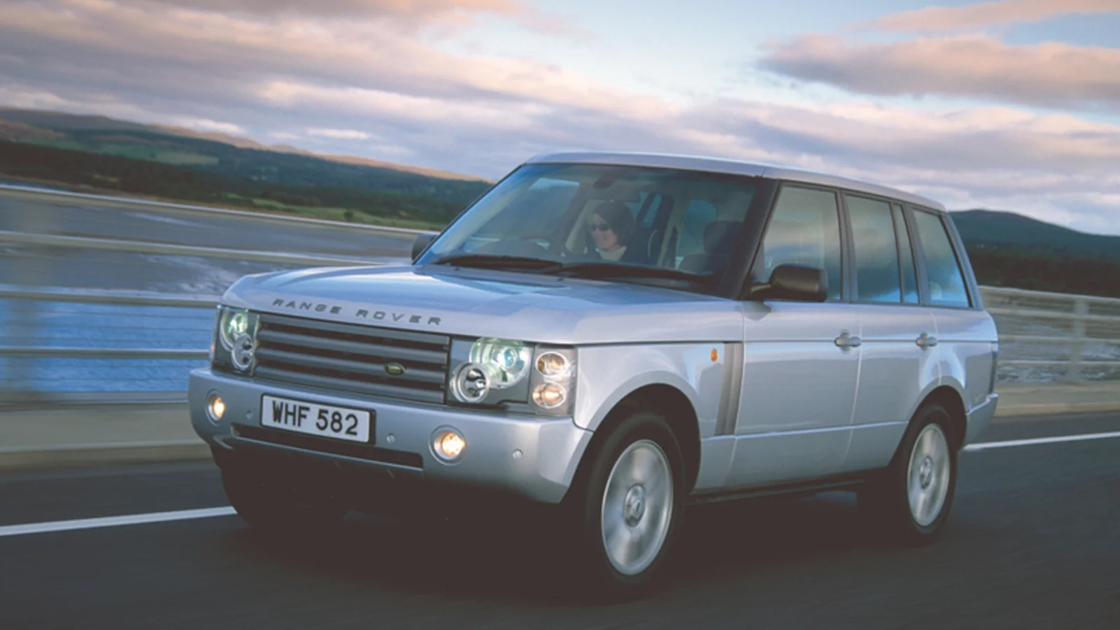 Range Rover Classic driving on road