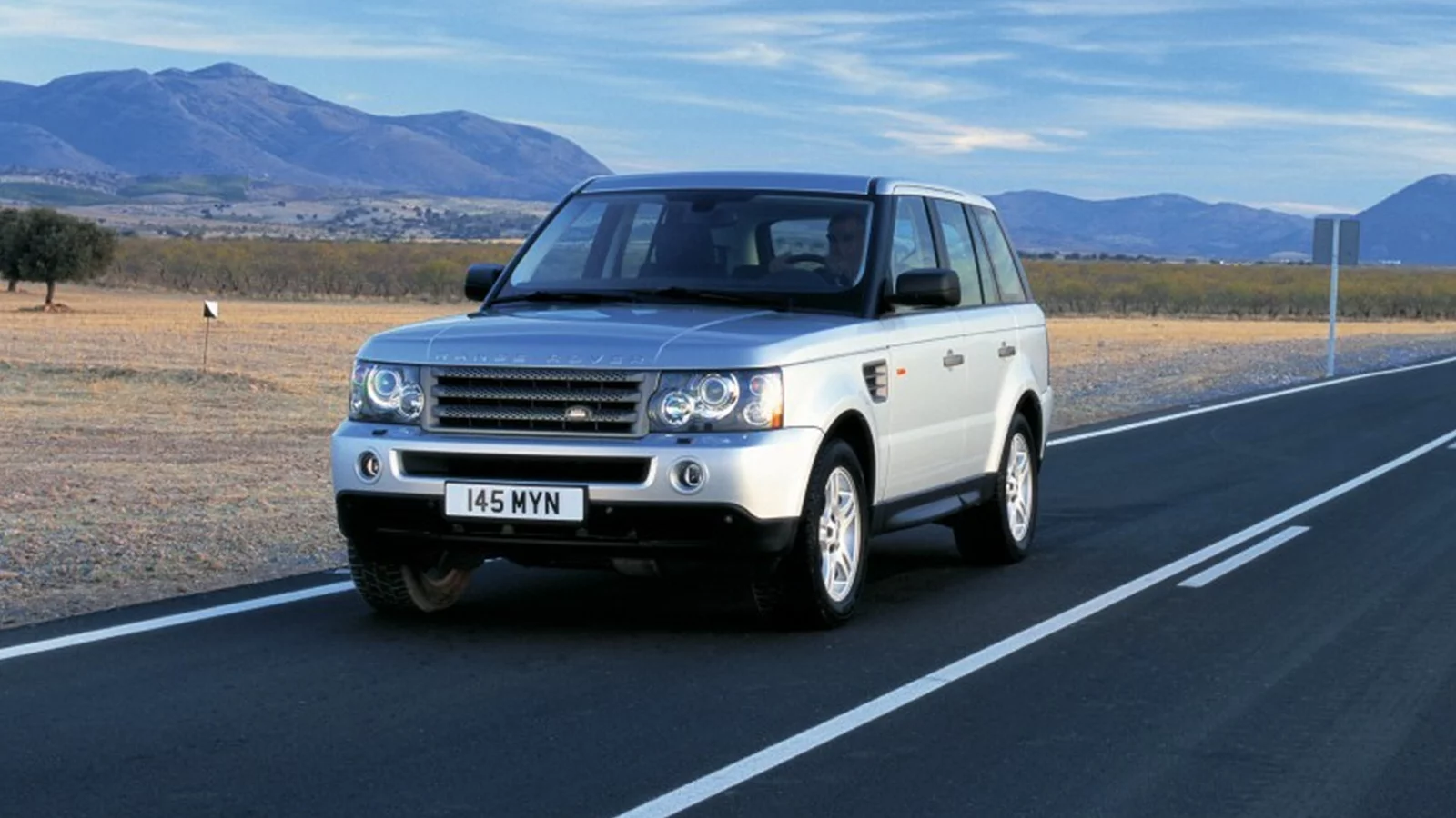 Range Rover driving on Road