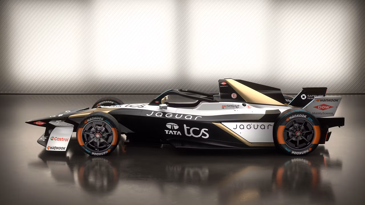 Side view of a Black and White Jaguar Racing Car .