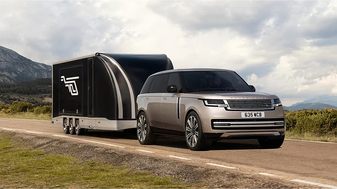 New Range Rover driving on mountain runway road