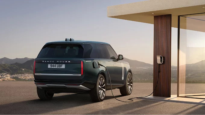 Parked Range Rover charging at the phev station point