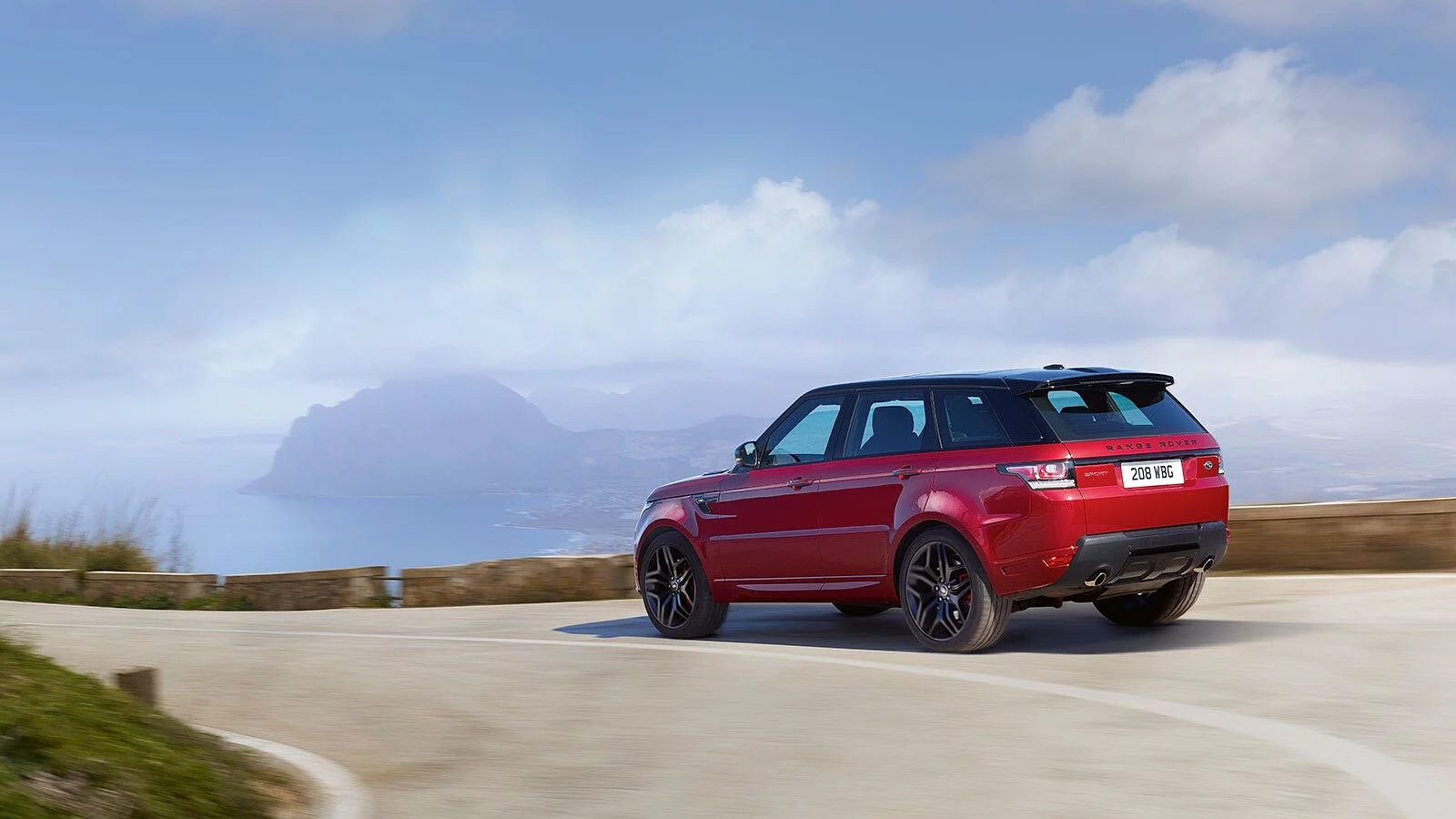 Range Rover Sport car driving on the street