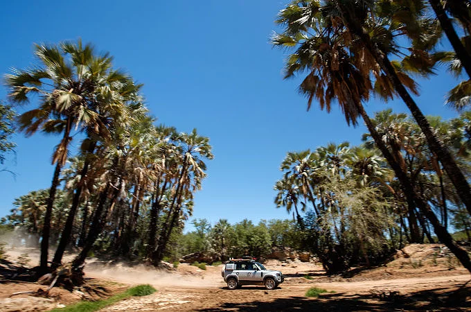 KIWI JOURNALIST DAVID LINKLATER TRIES OUT THE NEW DEFENDER IN NAMIBIA