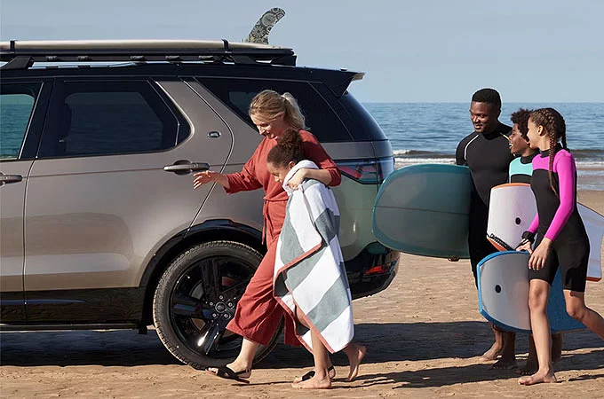 Family Picnic On A Beach Side With Discovery