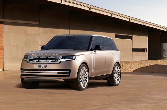 New Range Rover in gold front side view