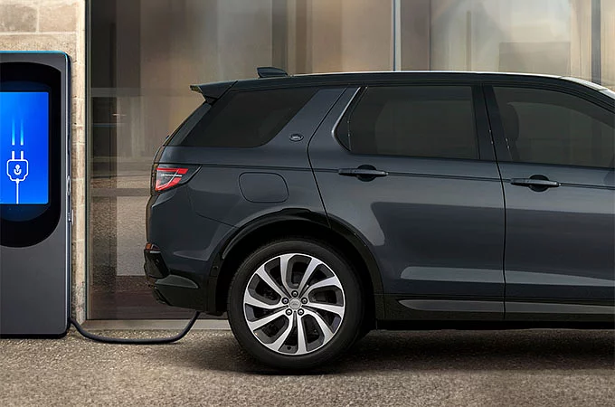 Discovery sport standing at charging Phev point